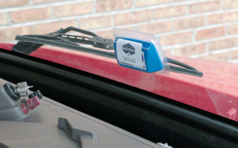 Bestpass’s E-ZPass toll transponder mounted on a truck windshield 